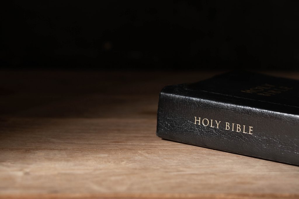 TheREDWords.website/BLOG page. A photo of the Holy Bible on a wooden table.